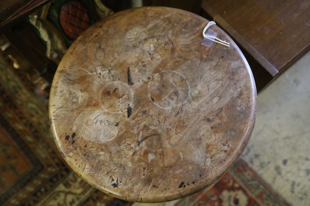 A 19th century elm candle stand, with burr wood top on tripod base, 37cm diameter, 72cm high